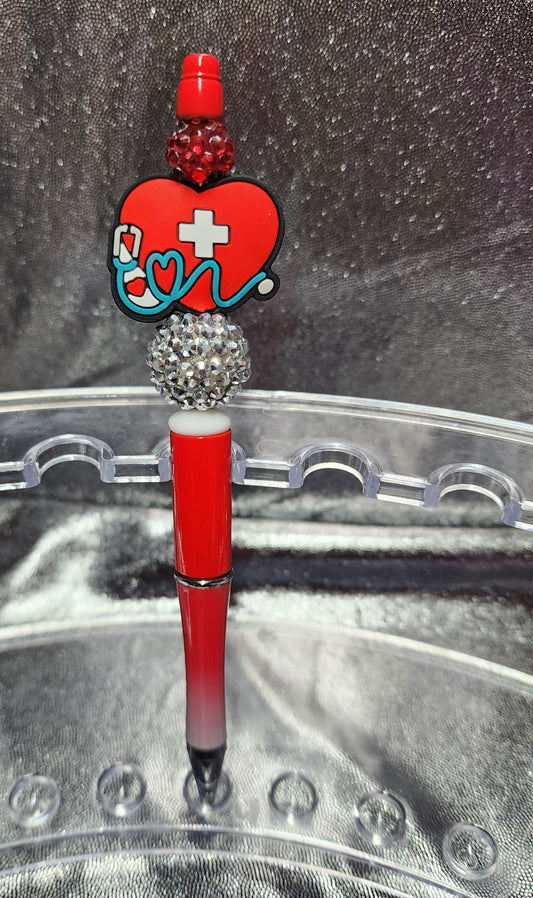 RED HEALTHCARE HEART WITH A STETHOSCOPE